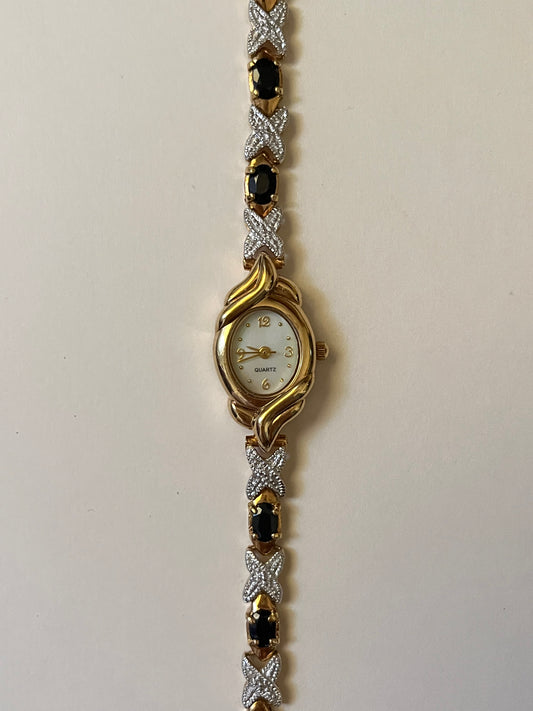 Lovely Vintage Gold Tone Watch with Decorative Oval Dial and Black Stones Accent
