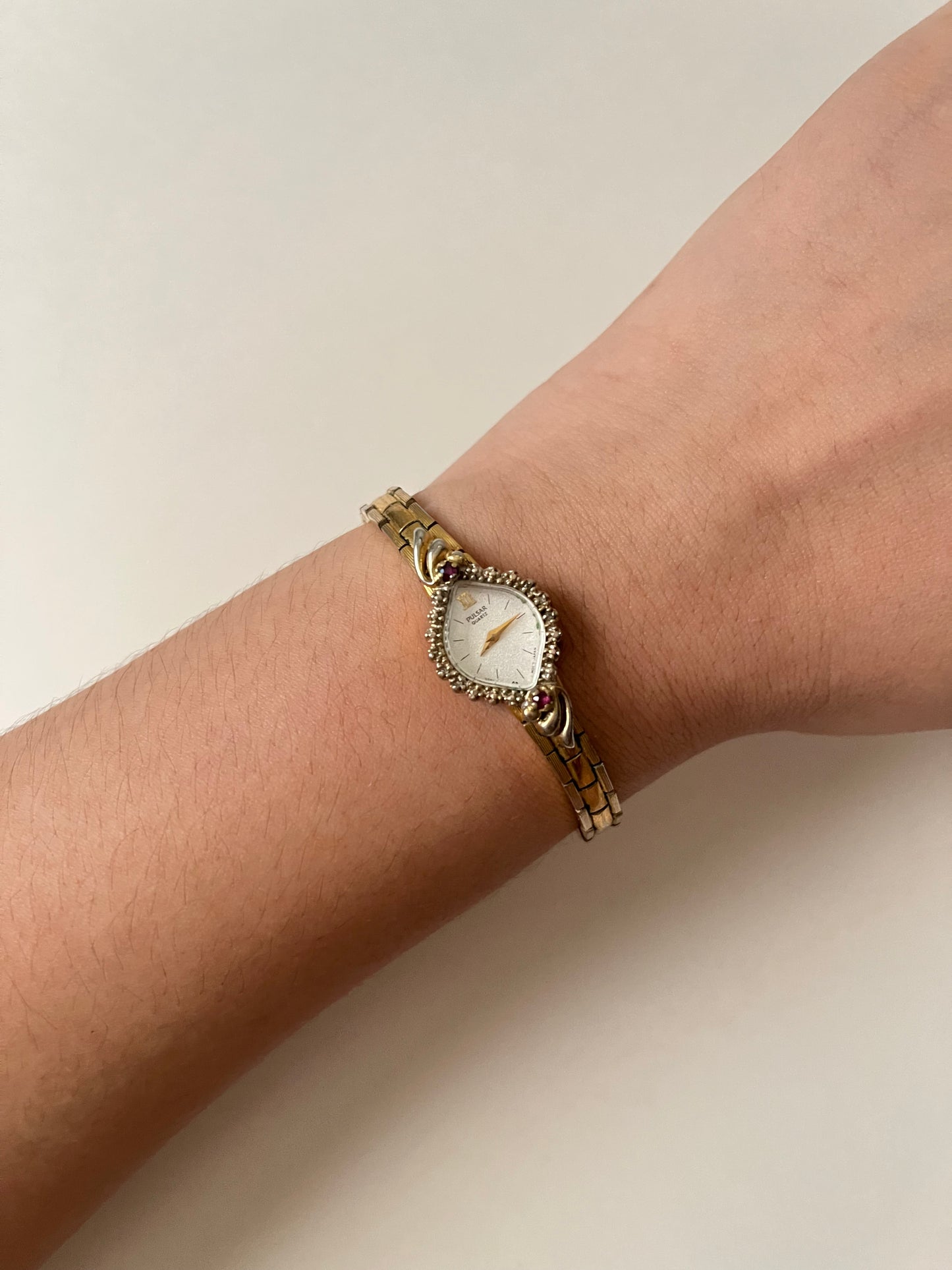 Lovely Gold Tone Pulsar Watch with Rubies Accent and Diamond-Shaped Dial