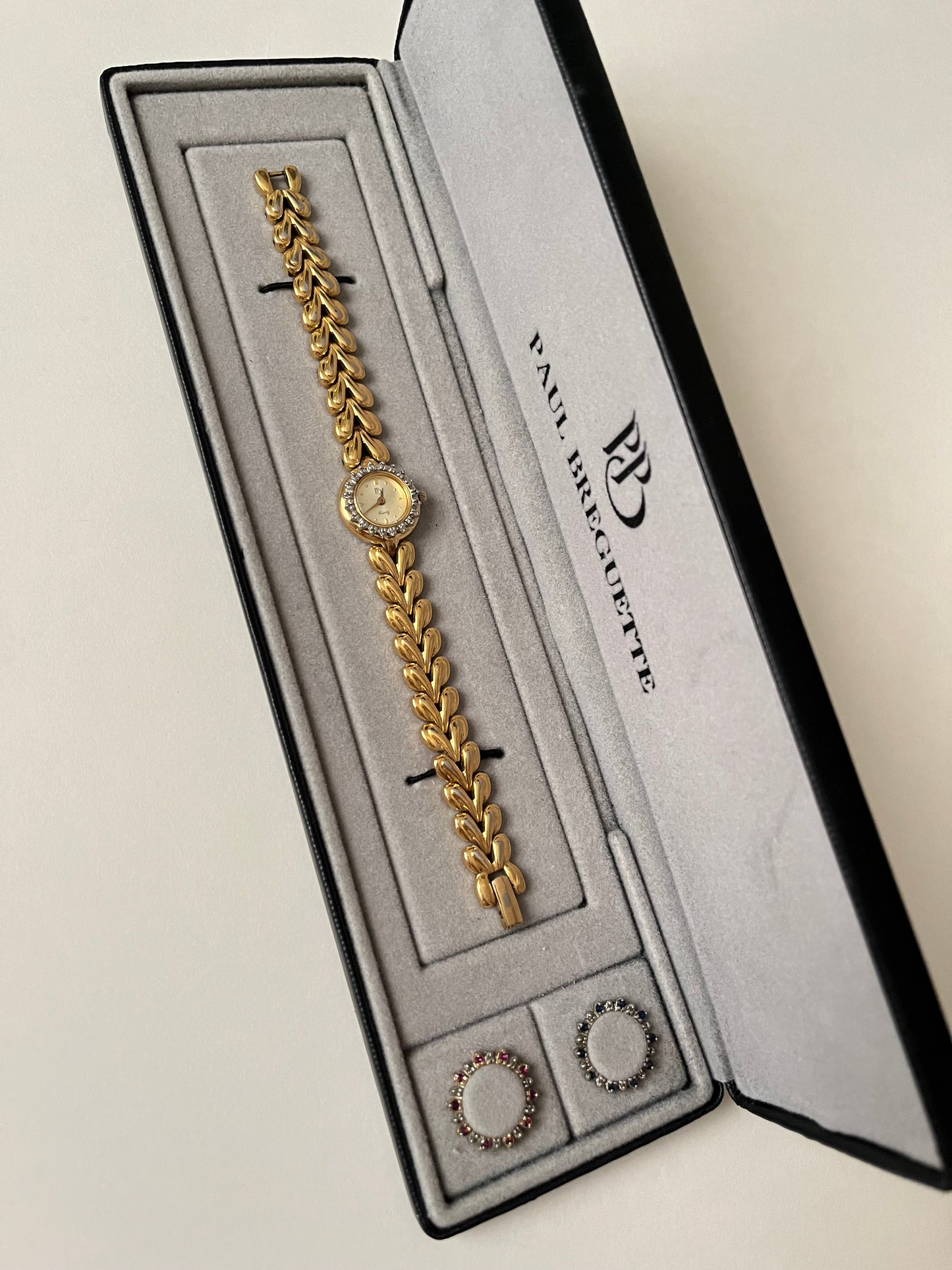 Beautiful Vintage Gold Tone Swiss Watch with Interchangeable Rubies and Sapphires Inset Bezels