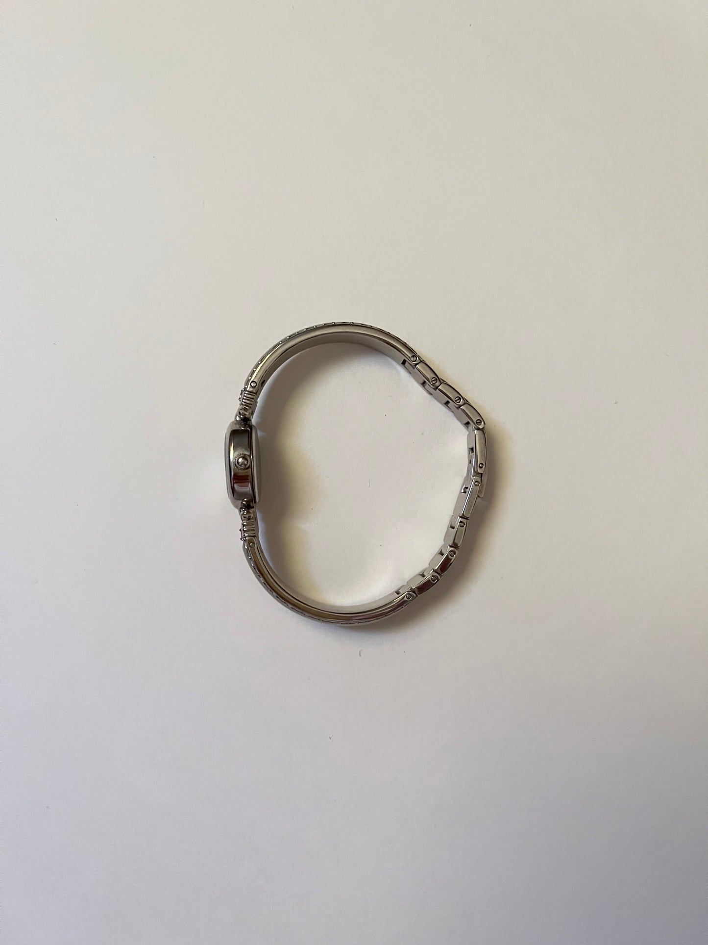 Silver Tone Anne Klein Cuff Watch with Oval Dial and Pink Stones Accent