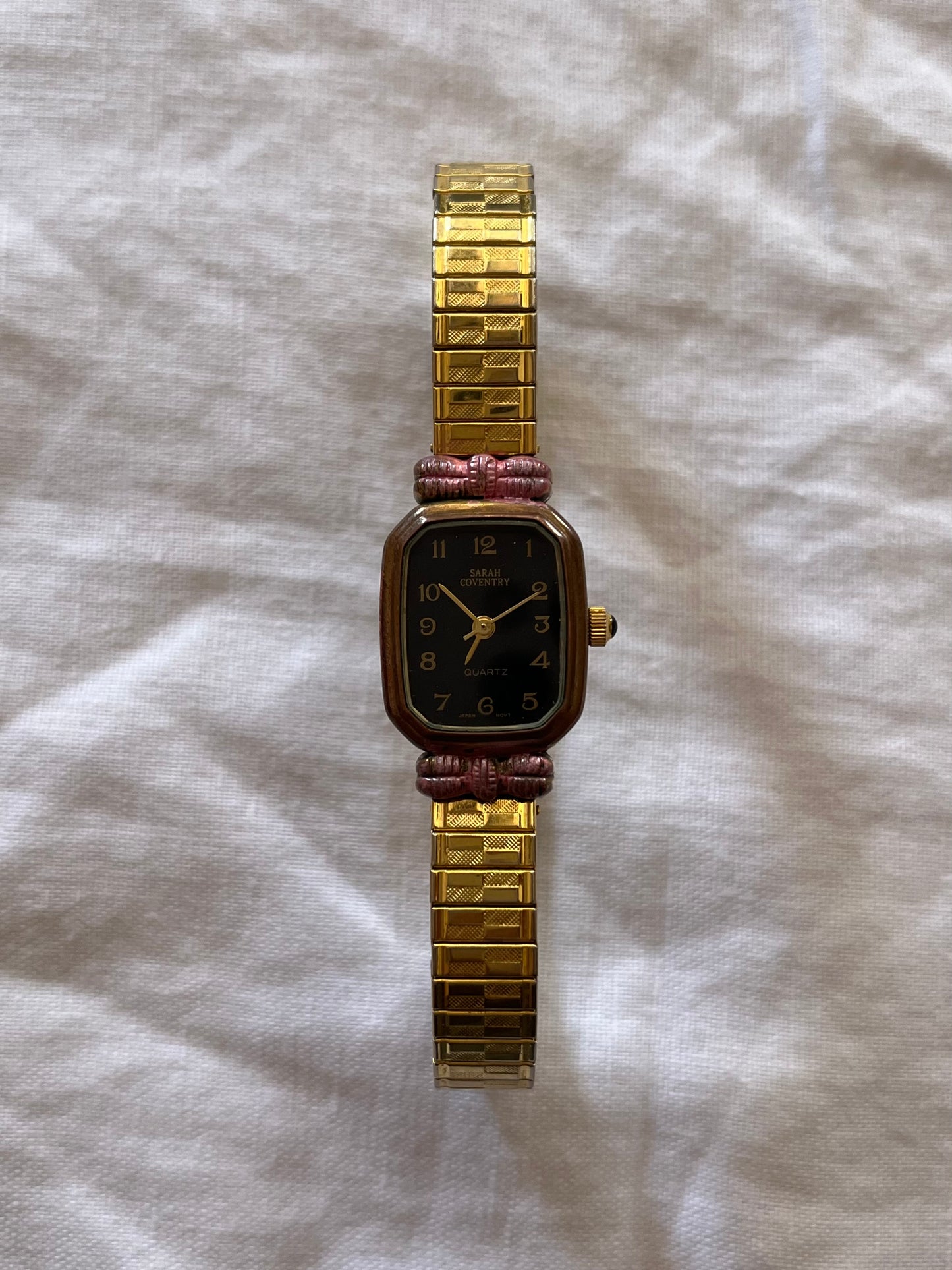 Gold Tone Expansion Watch with Pink Bow Accent