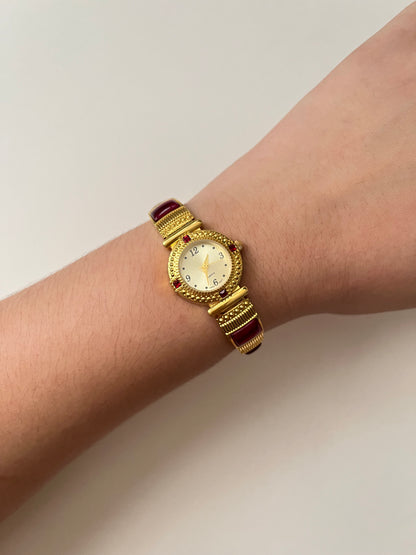 Gorgeous Gold Tone Expansion Watch with Red Gems Accent