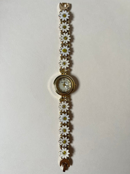Adorable Gold Tone Sliding Watch with Round Dial and White Daisies as Links