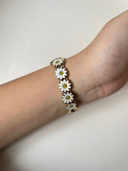 Adorable Gold Tone Sliding Watch with Round Dial and White Daisies as Links