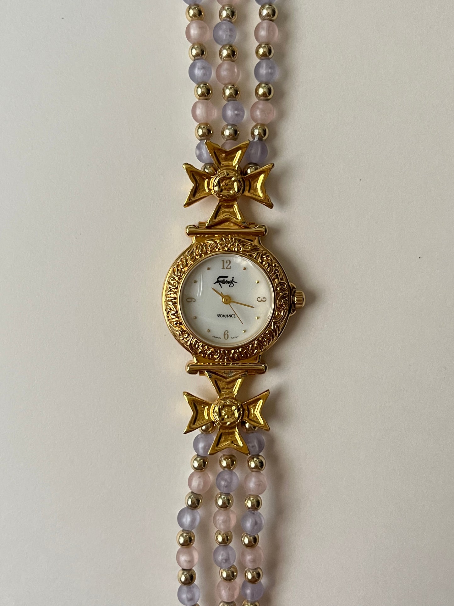 Adorable Gold Tone Watch with Pink and Purple Beaded Band