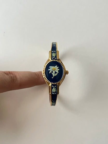 Beautiful Gold Tone Open Cuff Peekaboo Swiss Watch with Navy Blue Floral Enameled Bracelet