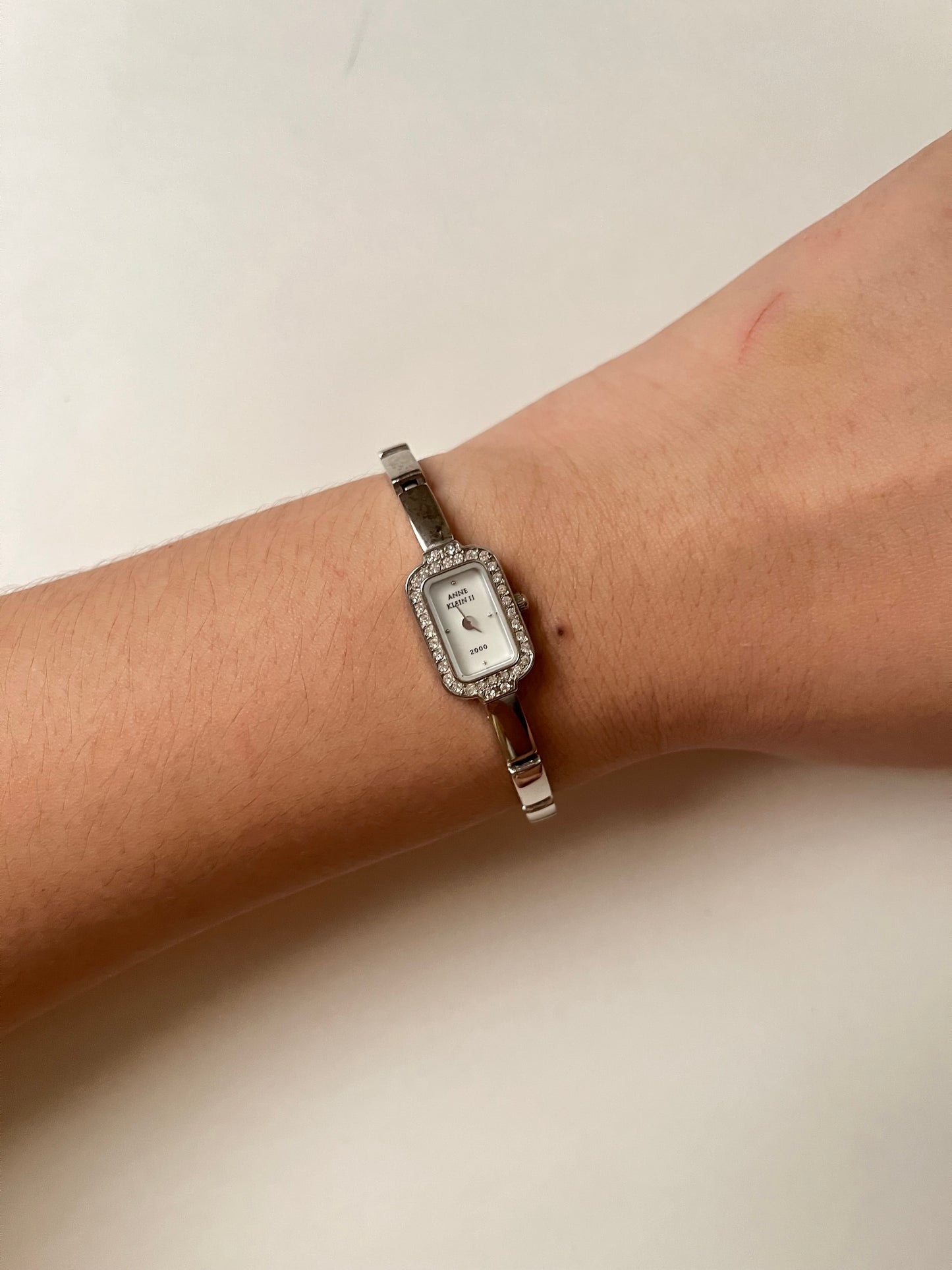 Lovely Dainty Silver Tone Anne Klein Watch with Crystal-Accented Rectangular Bezel