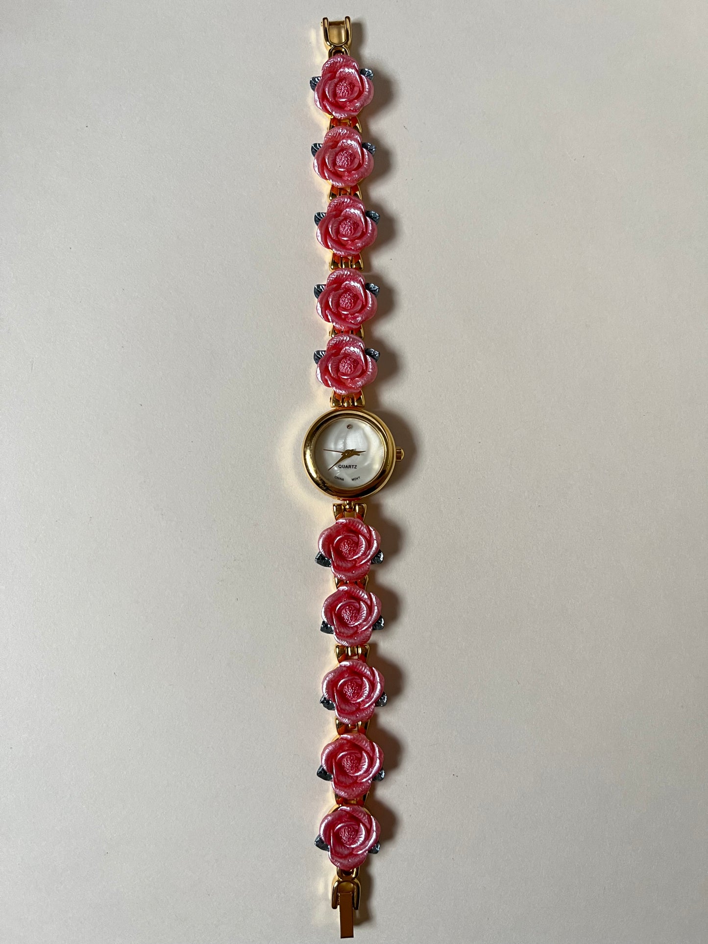 Pretty Gold Tone Watch with Round Dial and Pink Rose Links