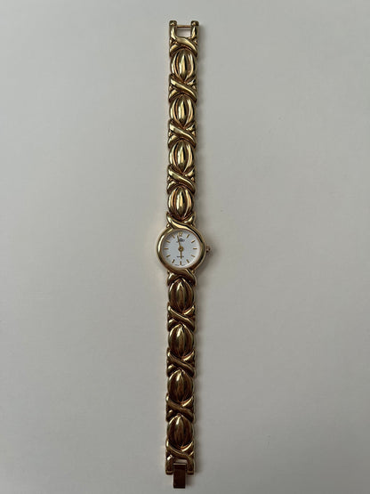 A Classic and Ornate Gold Tone Watch with Round Dial
