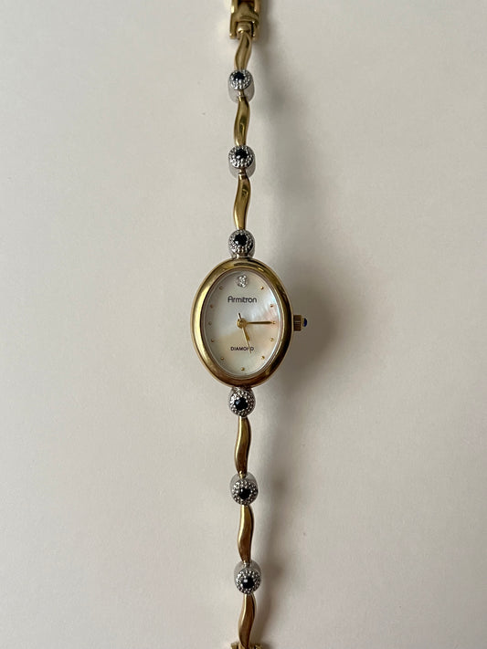Very Dainty Vintage Gold Tone Watch with Sapphires Accent and Oval Dial