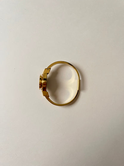Beautiful Gold Tone Open Cuff Peekaboo Swiss Watch with Navy Blue Floral Enameled Bracelet