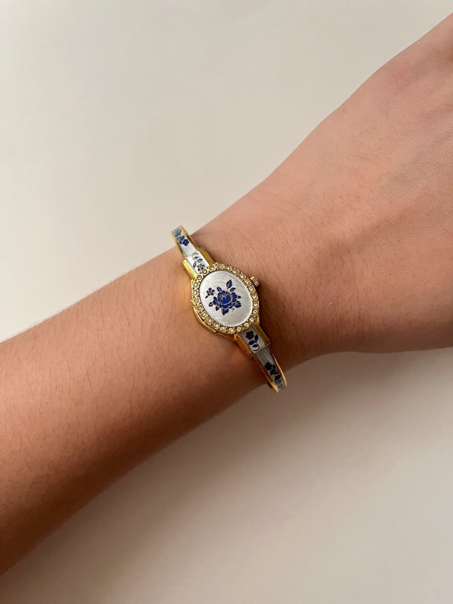 Beautiful Gold Tone Open Cuff Peekaboo Swiss Watch with Navy Floral Enameled Bracelet