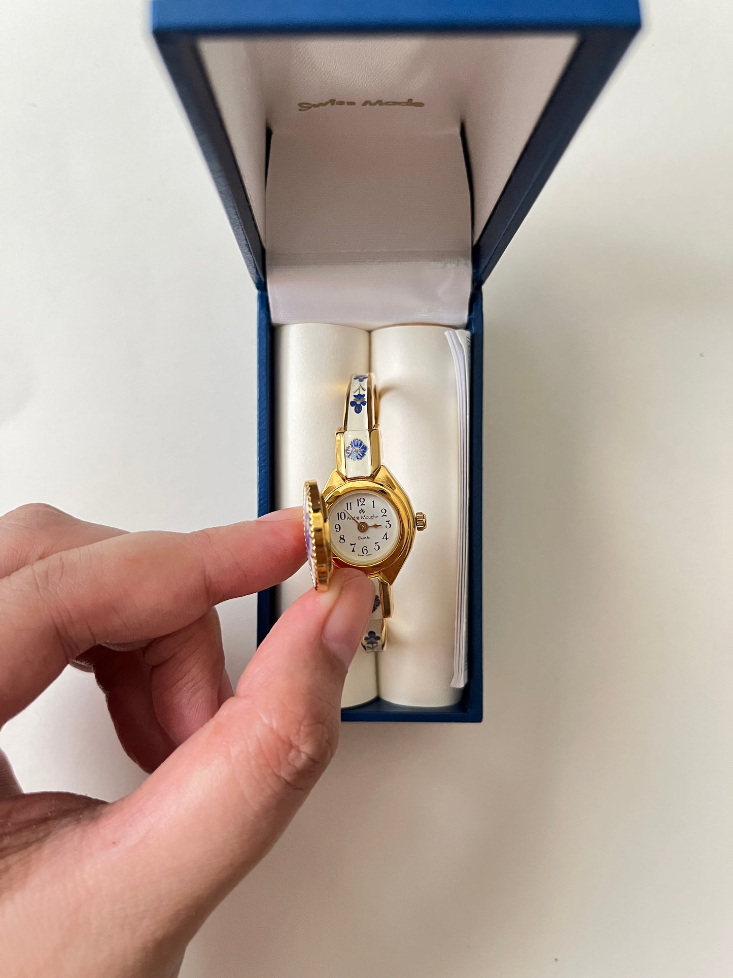 Beautiful Gold Tone Open Cuff Peekaboo Swiss Watch with Navy Floral Enameled Bracelet