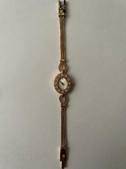 Elegant Dainty Gold Tone Tennis Bracelet Style Watch with Bejeweled Oval Dial