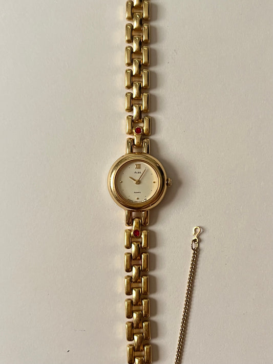 Beautiful Gold Tone Alba Watch with Round Dial with Red Gems