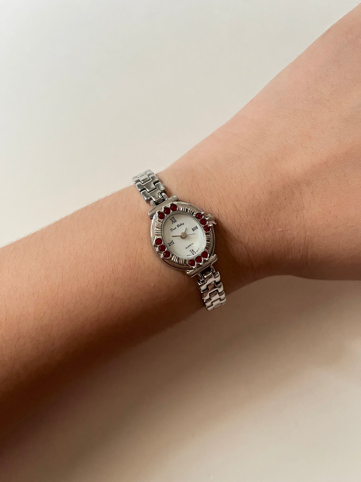 Beautiful Silver Tone Watch with Oval Dial and Gorgeous Red Gems Accent