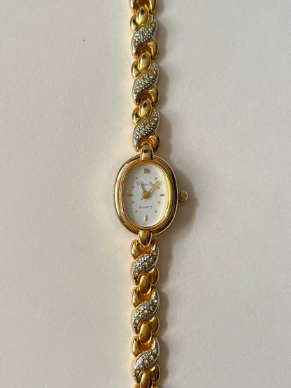 Dainty Gold Tone Watch with Oval Dial and Rhinestones Accent
