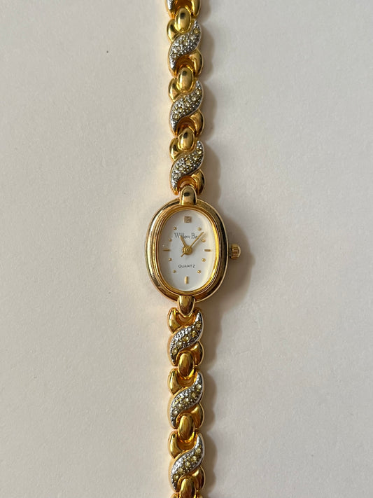 Dainty Gold Tone Watch with Oval Dial and Rhinestones Accent
