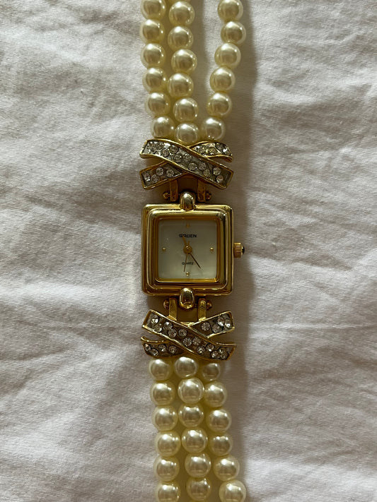 Beautiful Gold Tone Watch with Faux Pearl Bands and Bejeweled Cross Accent