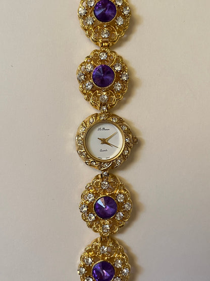 Extremely Rare and Breathtaking Gold Tone Watch with Ornate Band Design and Purple and Pink Stones Accent
