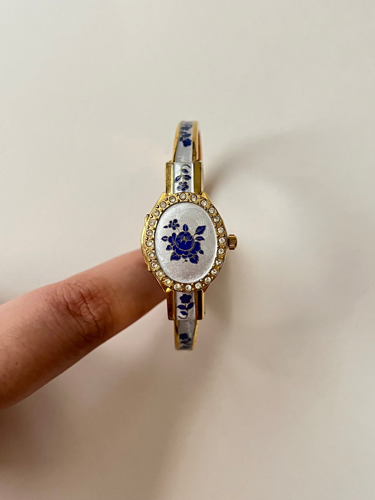 Beautiful Gold Tone Open Cuff Peekaboo Swiss Watch with Navy Floral Enameled Bracelet