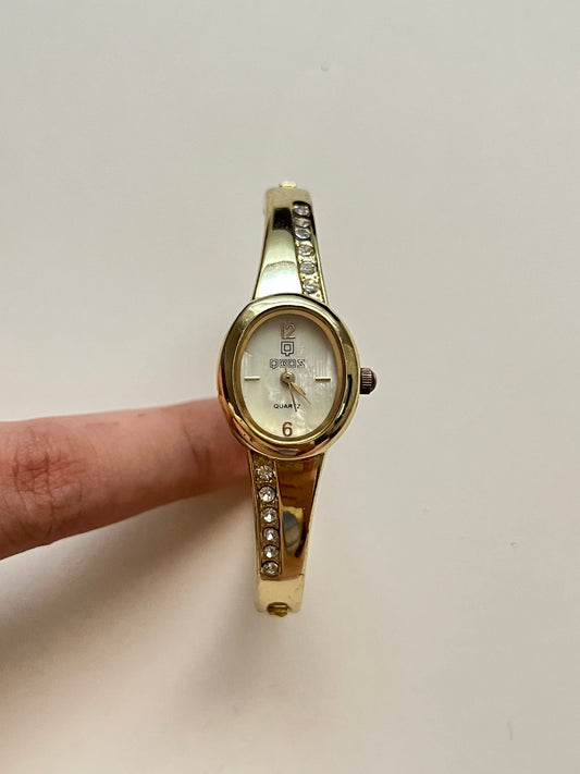 Gold Tone Cuff Watch with Oval Dial and Rhinestones Accent