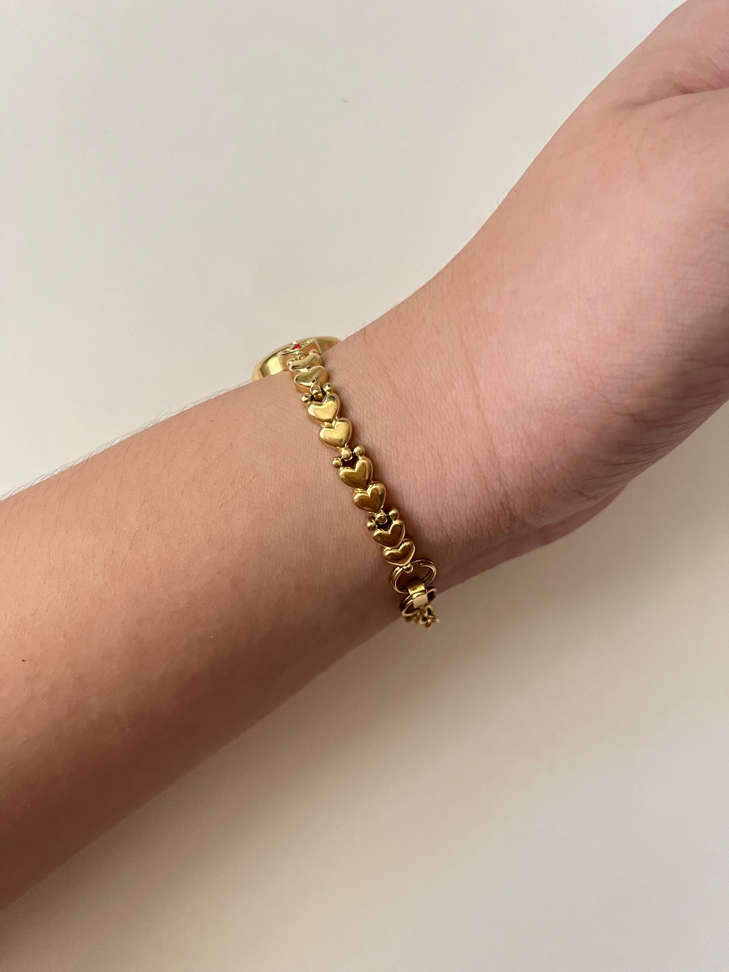 Adorable Dainty Gold Tone Swiss Watch with Heart-Shaped Links And Red Stones Accents