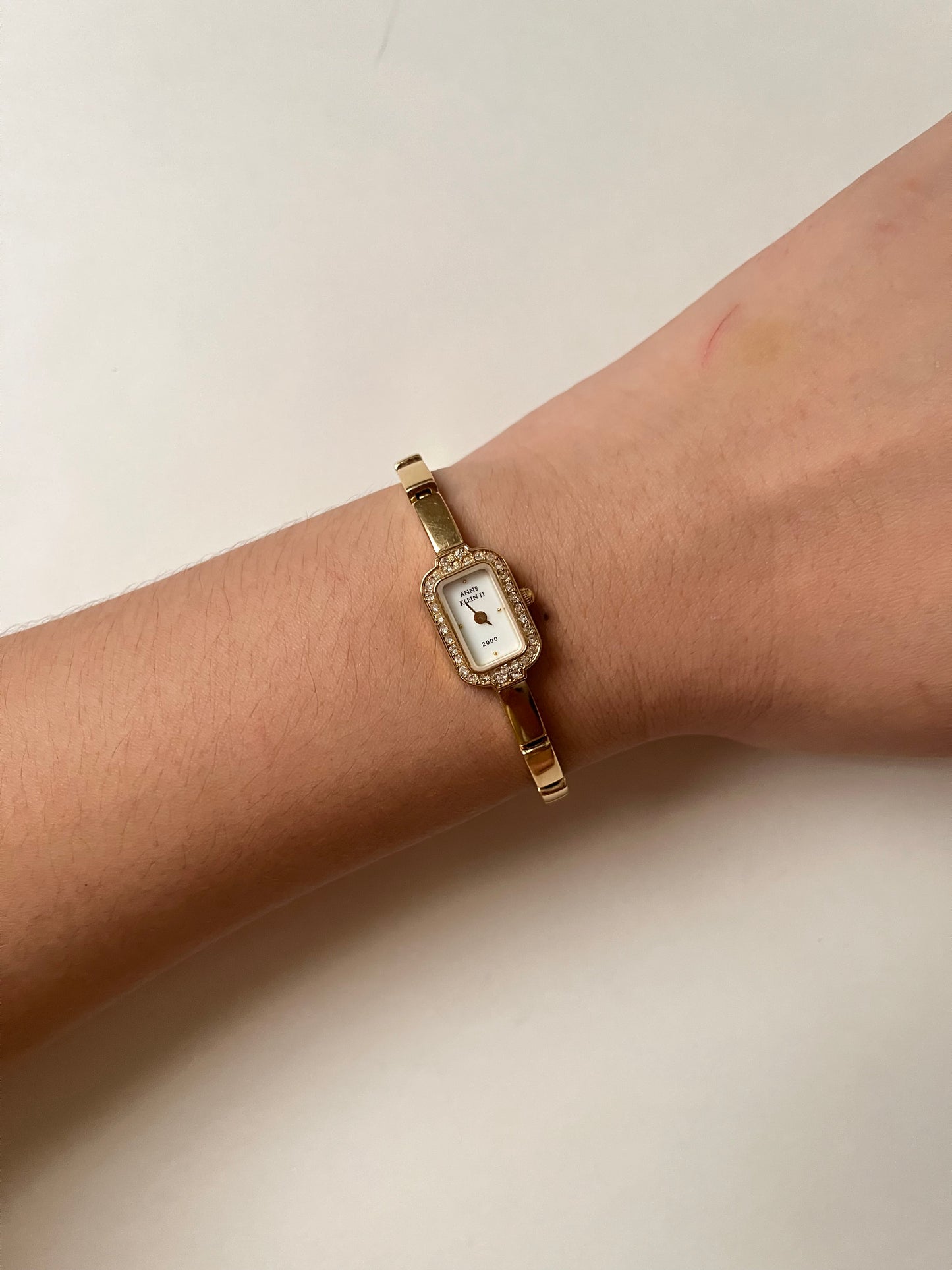 Lovely Dainty Gold Tone Anne Klein Watch with Crystal-Accented Rectangular Bezel