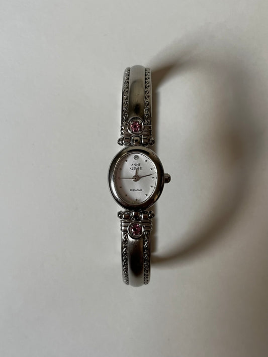 Silver Tone Anne Klein Cuff Watch with Oval Dial and Pink Stones Accent
