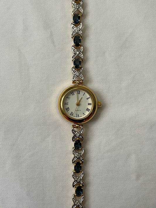 Very Elegant Gold Tone Watch with Stunning Blue Sapphire Stones Accent