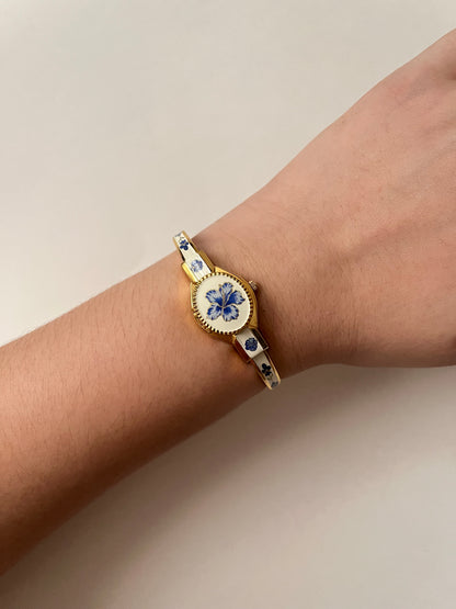 Beautiful Gold Tone Open Cuff Peekaboo Swiss Watch with Navy Floral Enameled Bracelet
