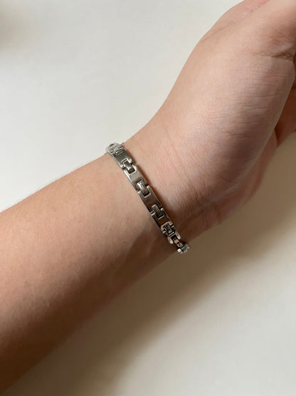 Dainty Silver Tone Watch with Tiny Charm and Rectangular Dial