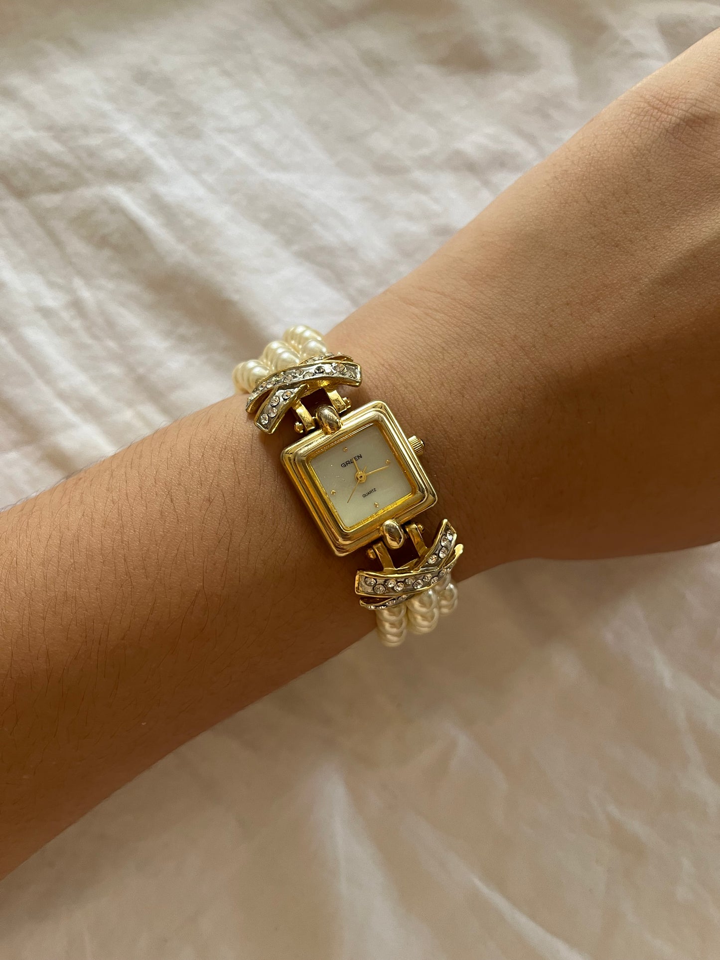 Beautiful Gold Tone Watch with Faux Pearl Bands and Bejeweled Cross Accent