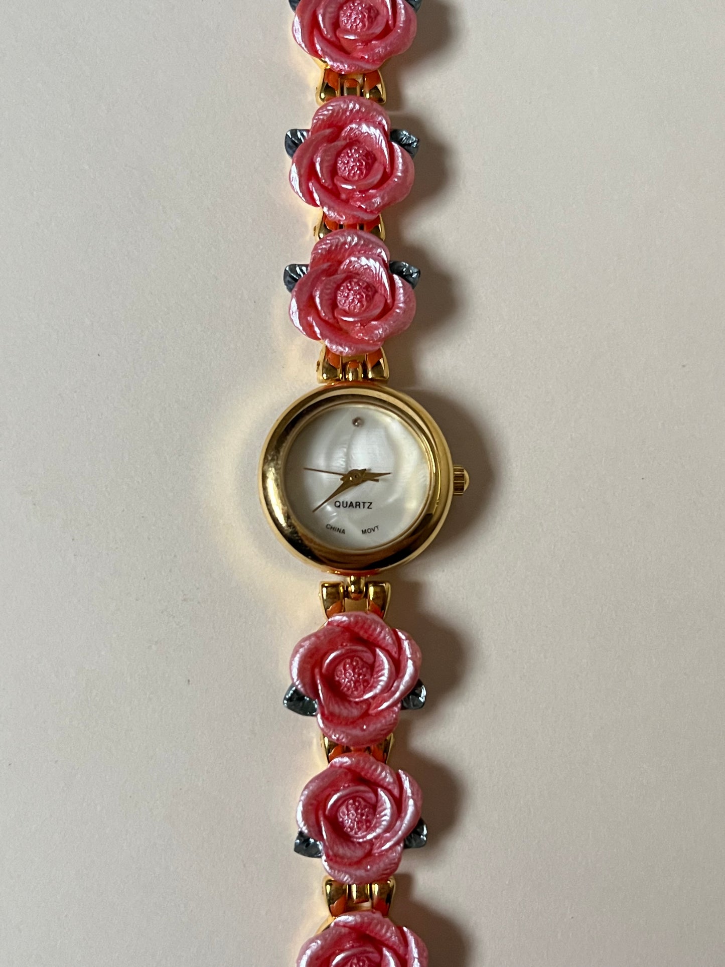 Pretty Gold Tone Watch with Round Dial and Pink Rose Links