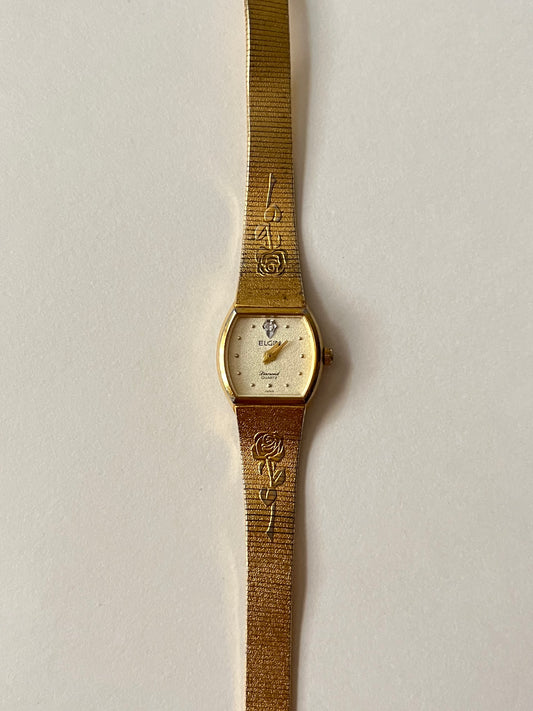 Elegant Vintage Gold Tone Watch with Rose Stem Accents