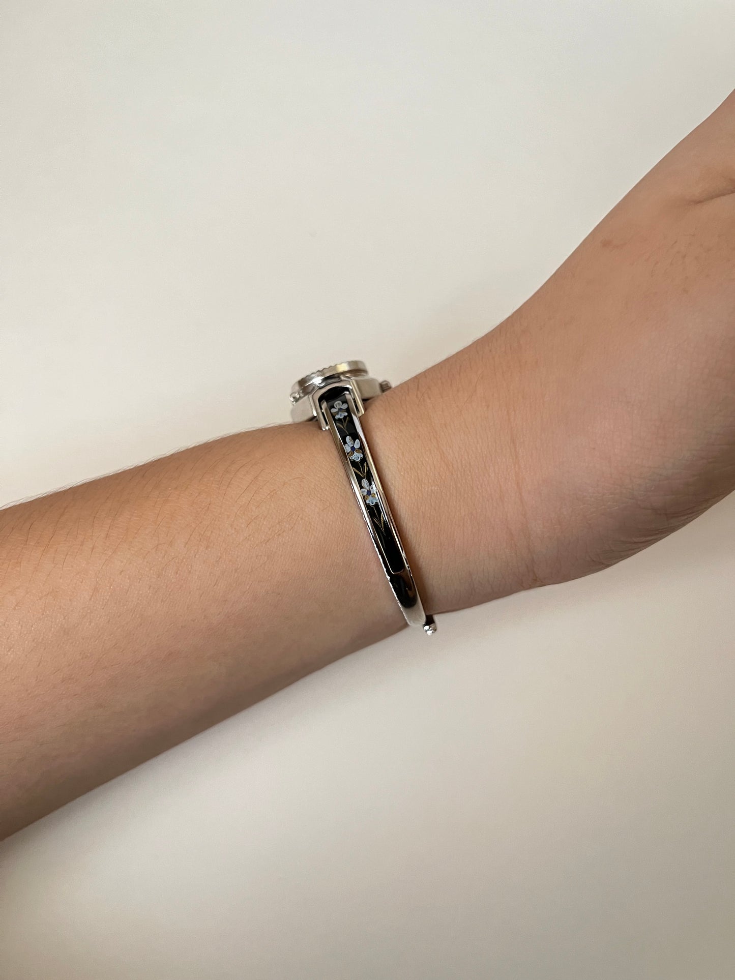 Beautiful Silver Tone Open Cuff Peekaboo Swiss Watch with Black Floral Enameled Bracelet
