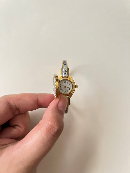 Beautiful Gold Tone Open Cuff Peekaboo Swiss Watch with Navy Floral Enameled Bracelet