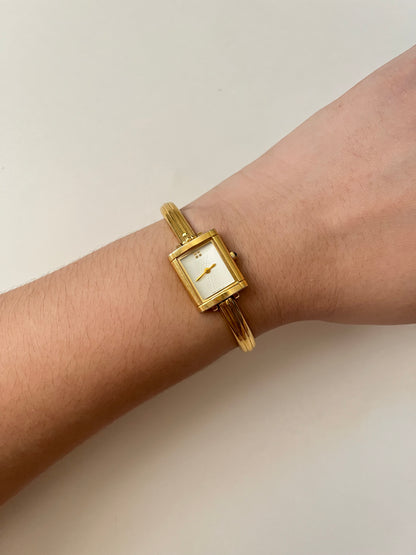 Elegant Gold Tone Yves Saint Laurent Tank Style Cuff Watch