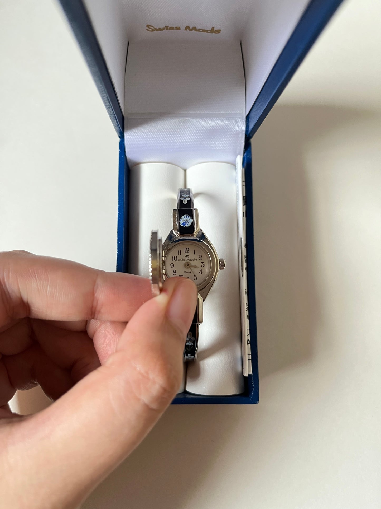 Beautiful Silver Tone Open Cuff Peekaboo Swiss Watch with Black Floral Enameled Bracelet