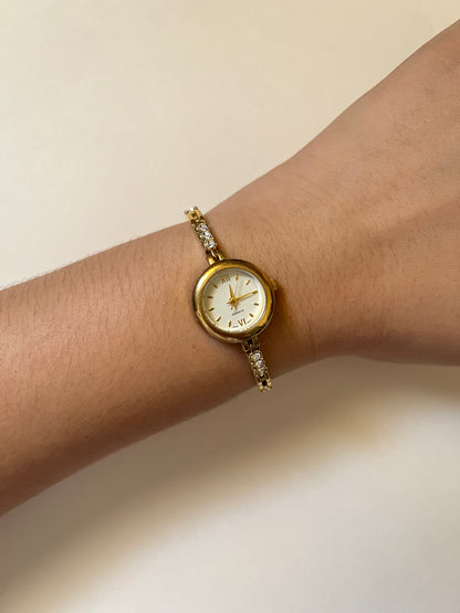Dainty Gold Tone Watch with Round Dial and Rhinestones Accent