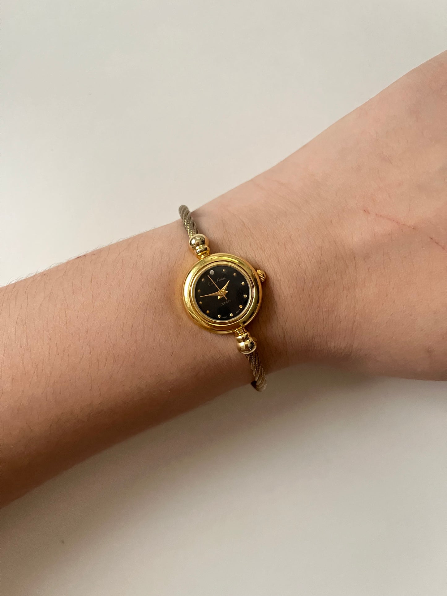 Gold Tone Open Cuff Watch with Interchangeable Bezels