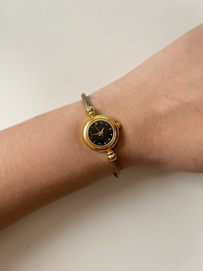 Gold Tone Open Cuff Watch with Interchangeable Bezels