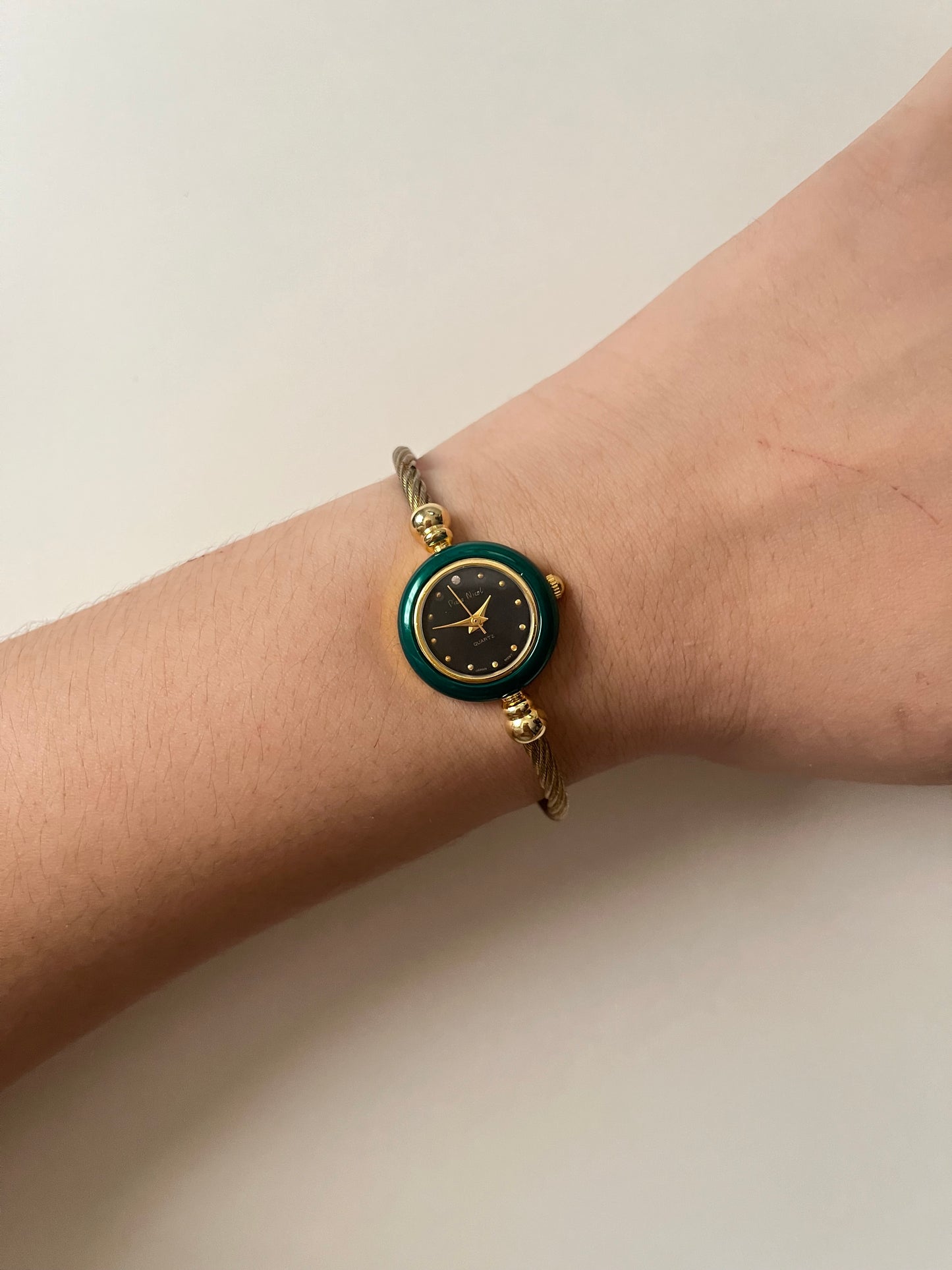 Gold Tone Open Cuff Watch with Interchangeable Bezels