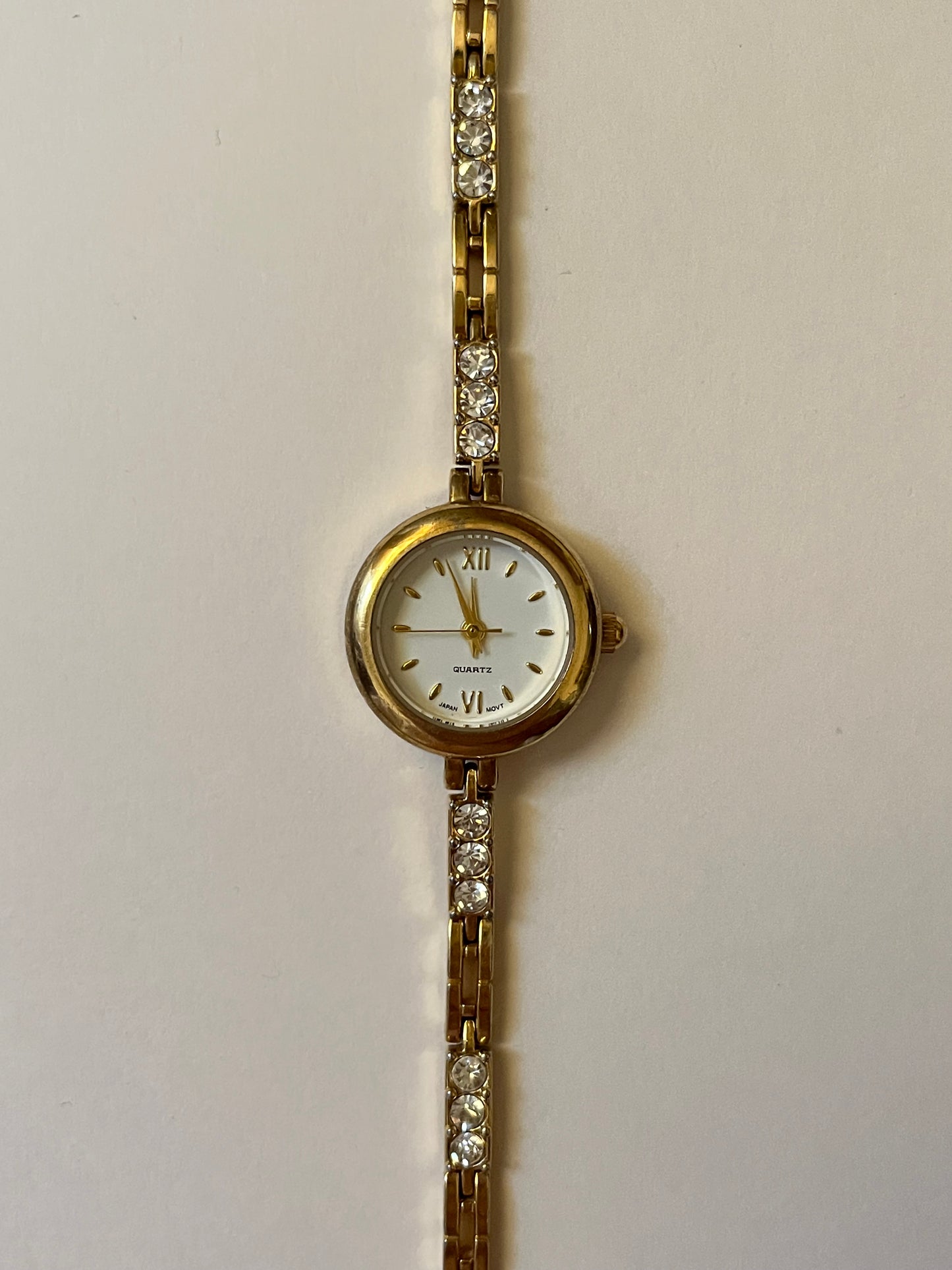 Dainty Gold Tone Watch with Round Dial and Rhinestones Accent