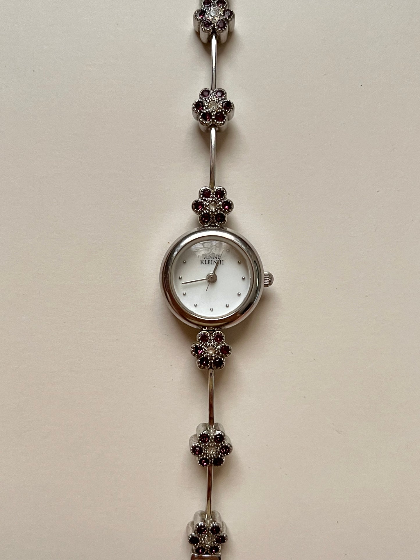 Cute and Dainty Silver Tone Anne Klein Watch with Purple Flower Rhinestones Accent