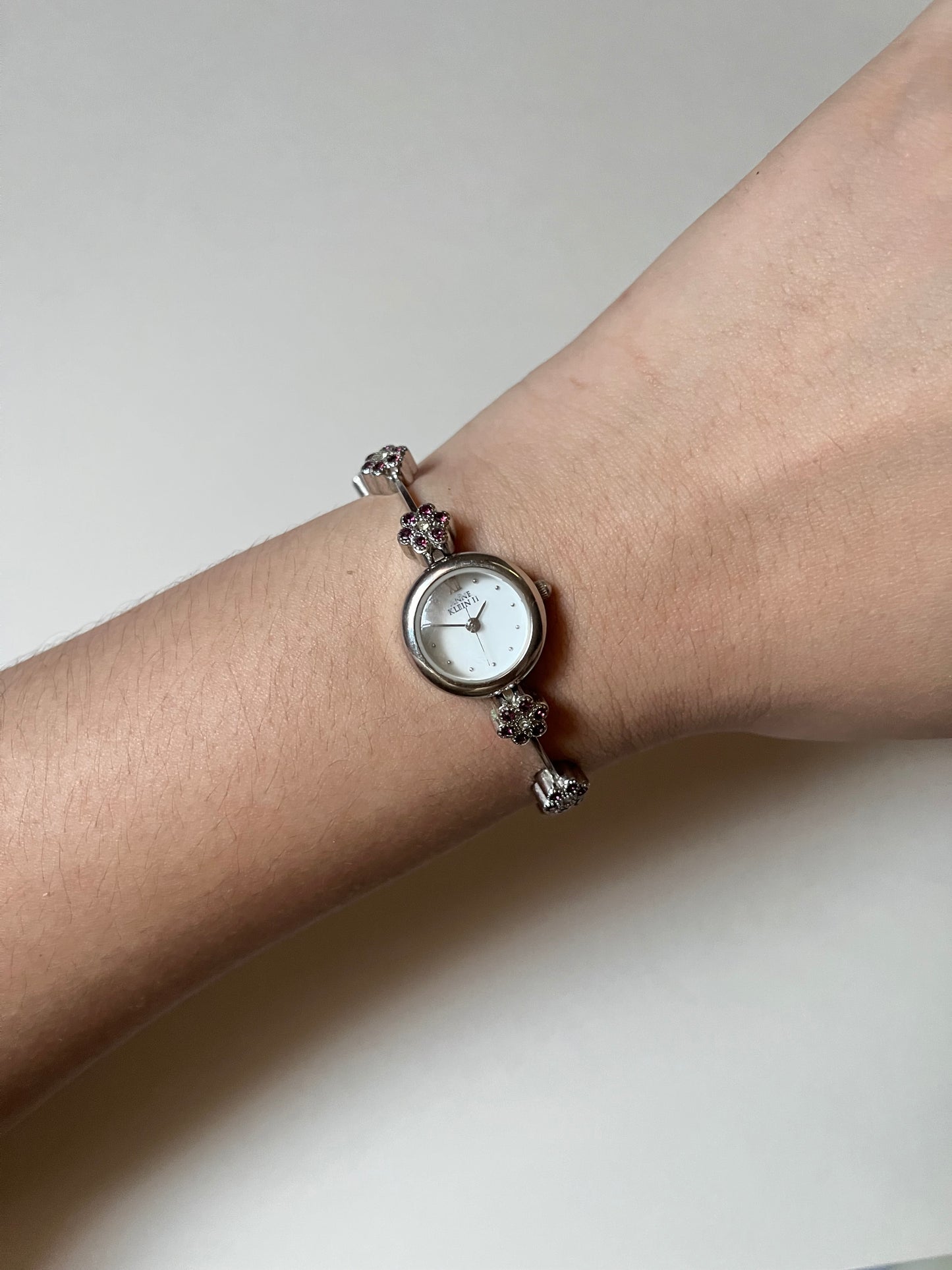 Cute and Dainty Silver Tone Anne Klein Watch with Purple Flower Rhinestones Accent