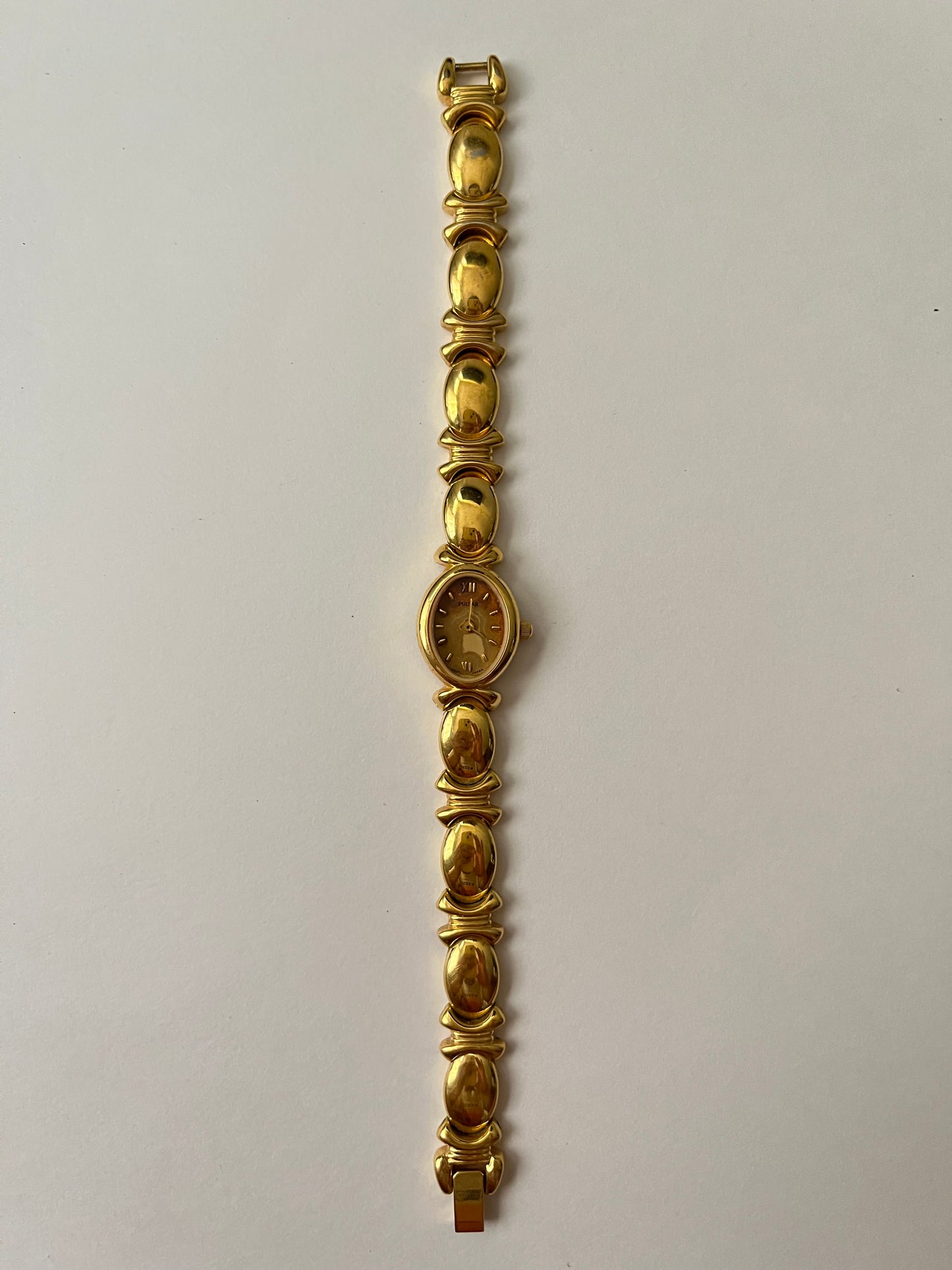 Stunning Gold Tone Pulsar Watch with Oval Dial