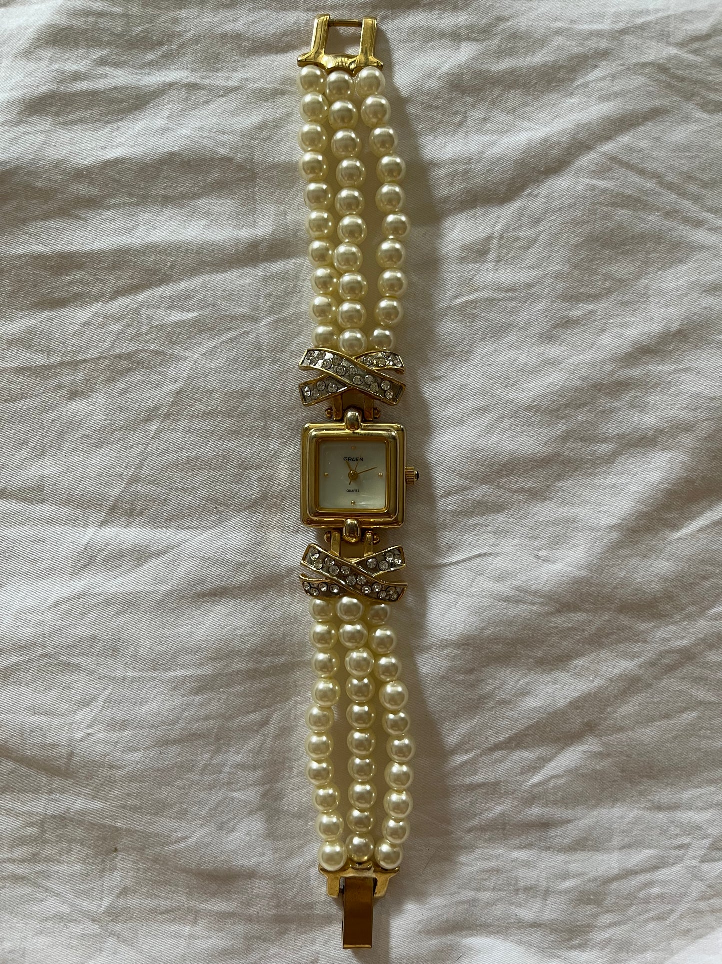 Beautiful Gold Tone Watch with Faux Pearl Bands and Bejeweled Cross Accent